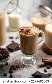 Coffee drink with milk, cinnamon and spices. Moody, autumn warm drinks
