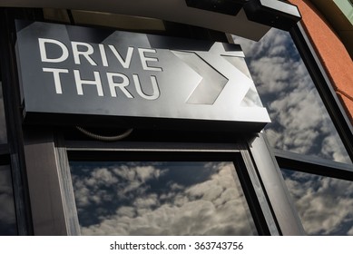 Coffee drive thru sign with reflect from glass window