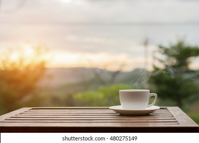 Coffee espresso on wood table nature background in garden,warm tone - Shutterstock ID 480275149