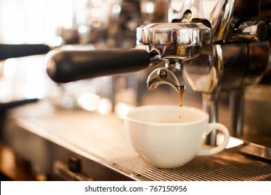 coffee extraction from professional coffee machine with bottomless filter - Powered by Shutterstock