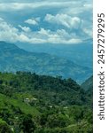 Coffee farm in the majestic Andes Mountains around Jerico, Jericó, Antioquia, Colombia. Fields, banana trees. Green landscape, cloudy sky.