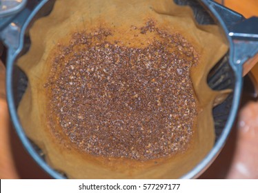 the coffee in the filter and brewed coffee close-up