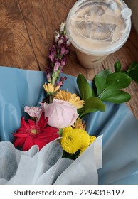 Coffee and flowers at the same time.