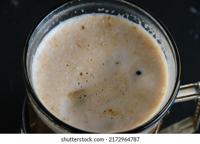 Coffee Foam Close Up Top View. Cappuccino In A Glass