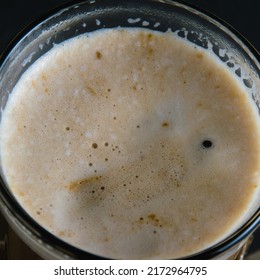 Coffee Foam Close Up Top View. Cappuccino In A Glass