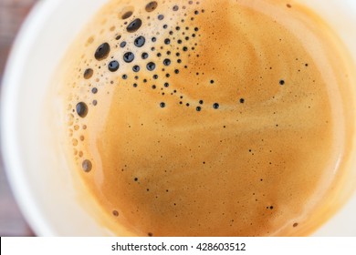 Coffee Foam Texture Close Up In Cup On Top View.