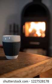 Coffee In Front Of A Woodstove. Fire And Coffee