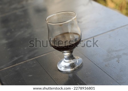 coffee in a glass that has run out is left with dregs