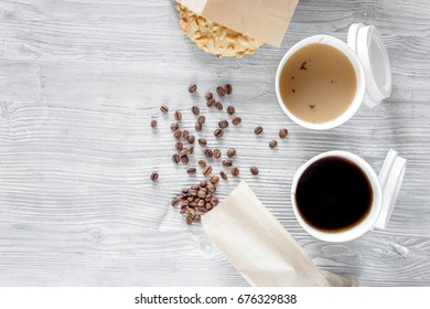 Coffee To Go. Coffee Cups With Cover And Coffee Beans On Wooden Table Backound Top View