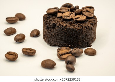 Coffee grounds pressed with coffee beans