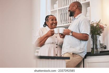 Coffee, happy and a talking black couple in the kitchen, laughing and relax in the morning. Smile, love and an elderly African man and woman speaking with a tea drink and conversation in a house - Powered by Shutterstock