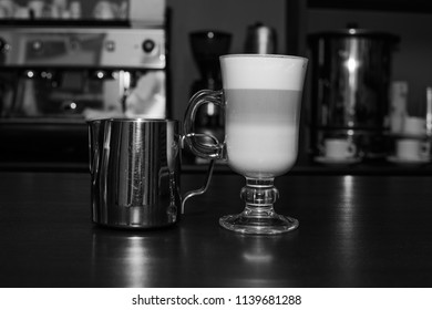 Coffee Latte With Creamer  On The Counter Of The Cafe