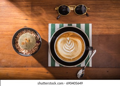 Coffee Latte Foam Arts In Heart Shape Top View With Props By Stylist, Lay On Wood Table.