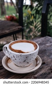 Coffee Latte Heart Art On The Black Wooden Table