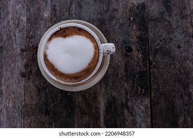 Coffee Latte Heart Art On The Black Wooden Table