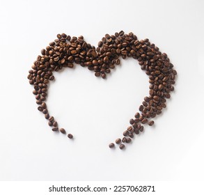 Coffee lover. Coffee beans arranged in a beautiful heart shape on white background.  Festive card for Valentines Day. top view. flat lay. 3D illustration - Powered by Shutterstock