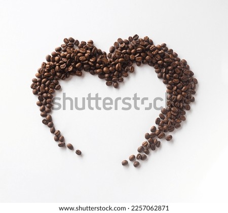 Coffee lover. Coffee beans arranged in a beautiful heart shape on white background.  Festive card for Valentines Day. top view. flat lay. 3D illustration