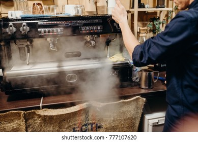 Coffee Machine With Steam In The Process A Cafe. Retro Picture With Little Noise. 