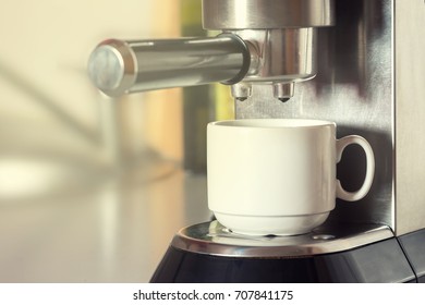 coffee machine with white cup