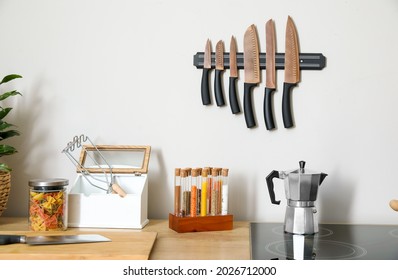 Coffee maker on stove and utensils in kitchen - Powered by Shutterstock