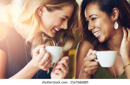 Coffee makes us do crazy things. Cropped shot of girlfriends enjoying their coffee at a cafe. - Shutterstock ID 2167686885