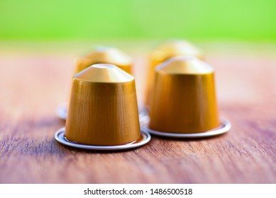 Coffee Makes The World Go Around. 4 Coffee Capsules Close Up.