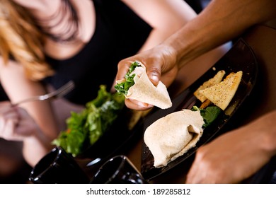 Coffee: Man Eating A Chicken Wrap