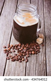 Coffee In Mason Jar On Wooden Background