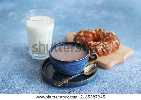 Coffee with milk and bun, healthy breakfast
