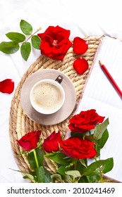 Coffee With Milk And Red Roses On The Circle Stand On The White Bedsheet. Room Service. Coffee Break. Love Story. Valentine's Day. Cozy Atmosphere.  
