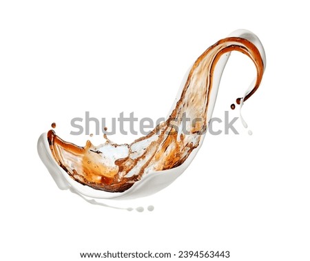 Coffee and milk splashes isolated on a white background. Mix of milk and coffee splashes in white space