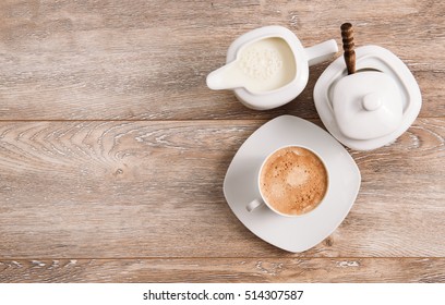 Coffee With Milk And Sugar On Wooden Table. Top View And Copy Space 