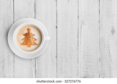 Coffee Mug With Christmas Tree Shape On White Wood Table