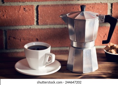 the coffee in mug and coffee maker