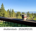 Coffee mug on a porch over looking Helena Montana