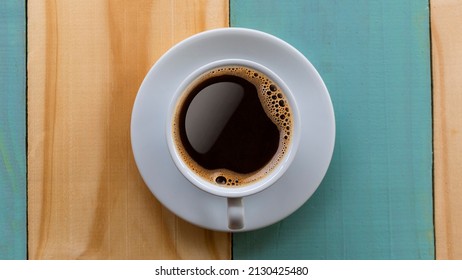 Coffee Mug On Wooden Table. Top View Cup Of Coffee On Wooden Table. Close Up Hot Coffe In White Cup On Wood Table.