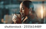 Coffee, night and smell with business woman in office for relax, working late and productivity. Aroma, caffeine break and overtime with female person drinking from mug for thinking, calm and latte