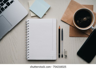 Coffee with notebook in the office