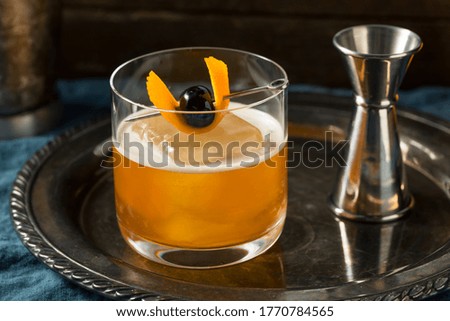 Coffee Old Fashioned Cocktail with Cherry and Orange