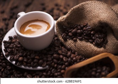 Coffee  on the coffee beans background