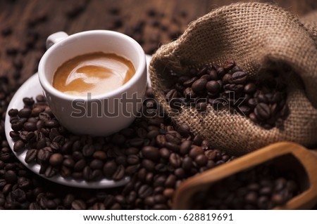 Coffee  on the coffee beans background