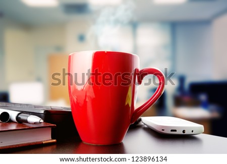 coffee on a black table showing break or breakfast in office