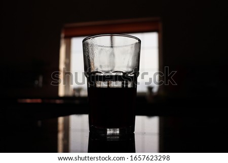 Similar – Image, Stock Photo a small glass of coffee and a white flower on a walnut table