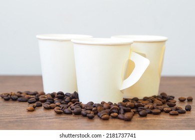 Coffee Paper Cup On Wooden Table. Mockup For You Designs.