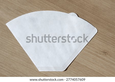 
It is a coffee paper filter.