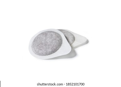 Coffee Pod Capsule for Italian Espresso Machine, Close-Up of a Pair, Disposable and Compostable Filter Paper – Isolated on White Background