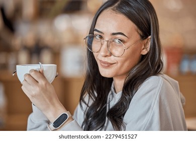 Coffee, portrait smile and woman at cafe with delicious caffeine, espresso or cappuccino. Face glasses, tea and happy female relax while holding cup, drink or mug with beverage at shop or restaurant.