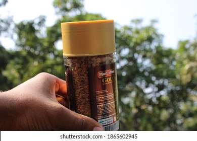 Coffee pot on the hand natural photo capture at Dhaka, Bangladesh. 2 December 2020