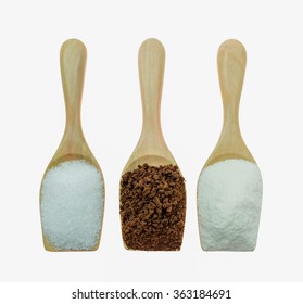 Coffee Powder And Creamer With Sugar Cubes On Wooden Spoon White Background