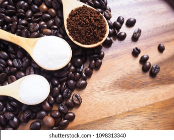 Coffee Powder, Sugar Powder, Creamer Powder In Wooden Spoon And Coffee Beans On Wooden Table Background.